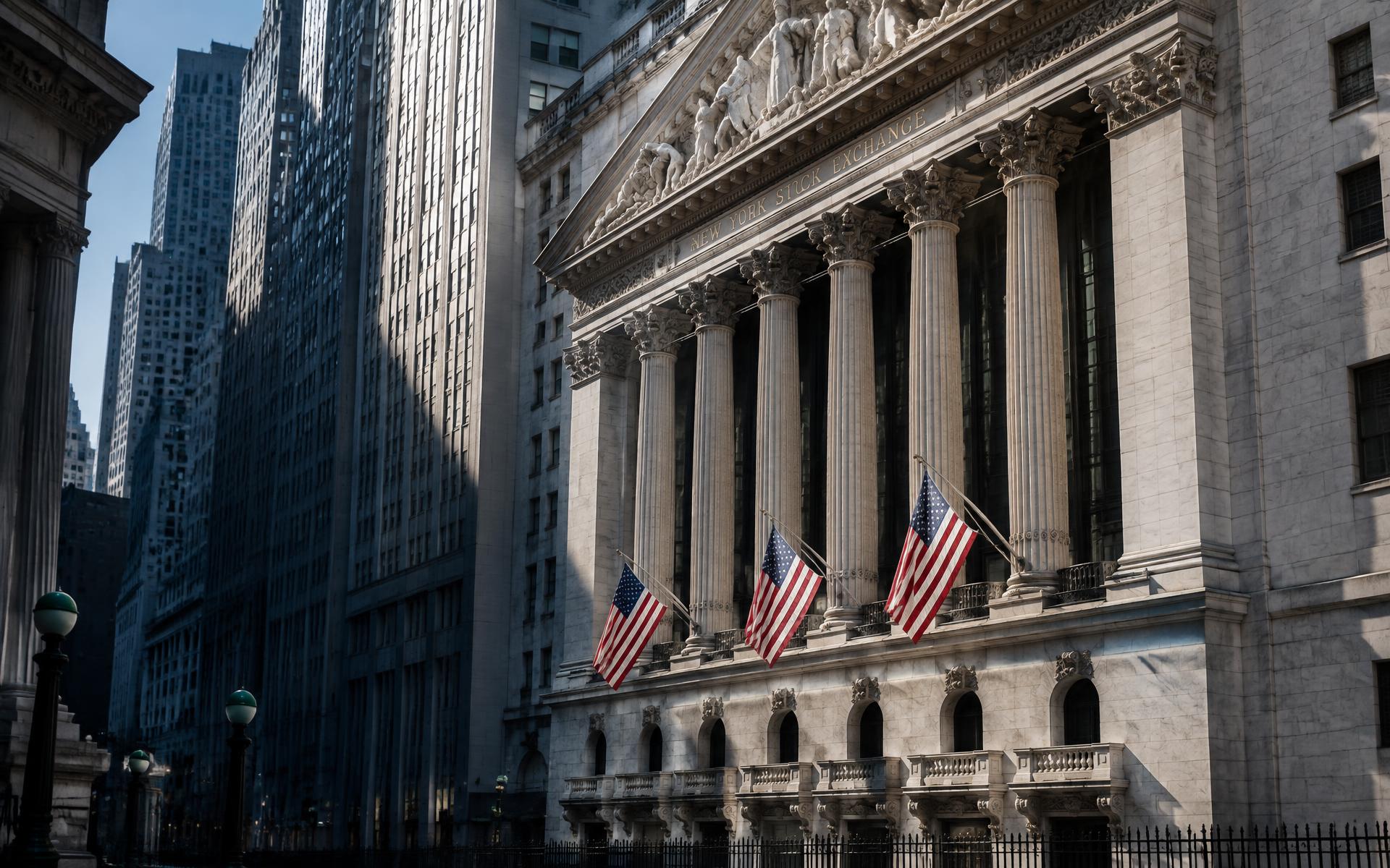 New York Stock Exchange facade and American flags on Wall Street